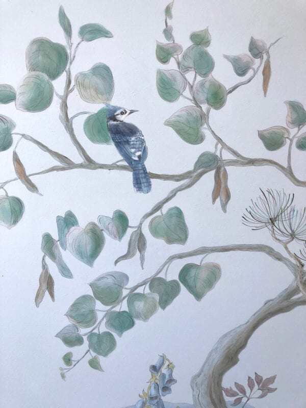 A "New England Harbor" chinoiserie art print of a blue jay perched on a branch.