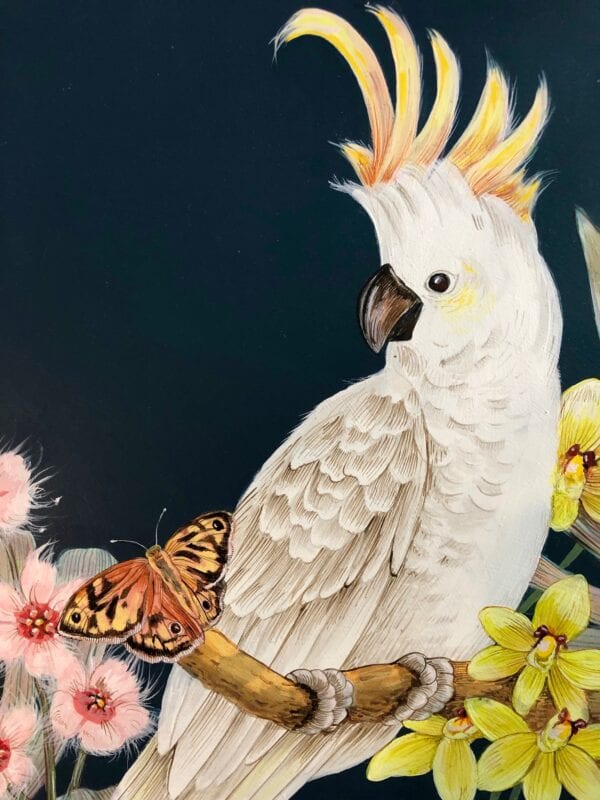 A Chinoiserie-style painting of a Cockatoo Party perched on a branch with a butterfly.