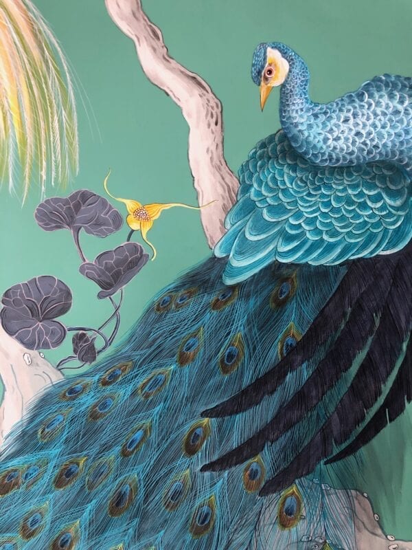 A painting of a blue peacock on a green background.