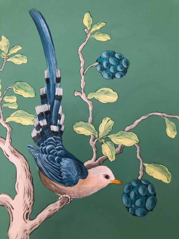 A painting of a blue bird perched on a branch.