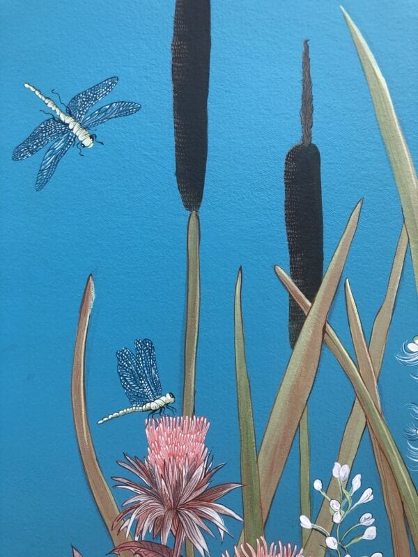 A "Nothing to Egret" coastal bird painting depicting dragonflies and reeds on a blue background.