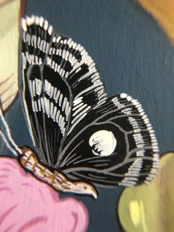 A "Beauty and the Beast" Chinoiserie Chic Tiger painting of a butterfly on a flower.