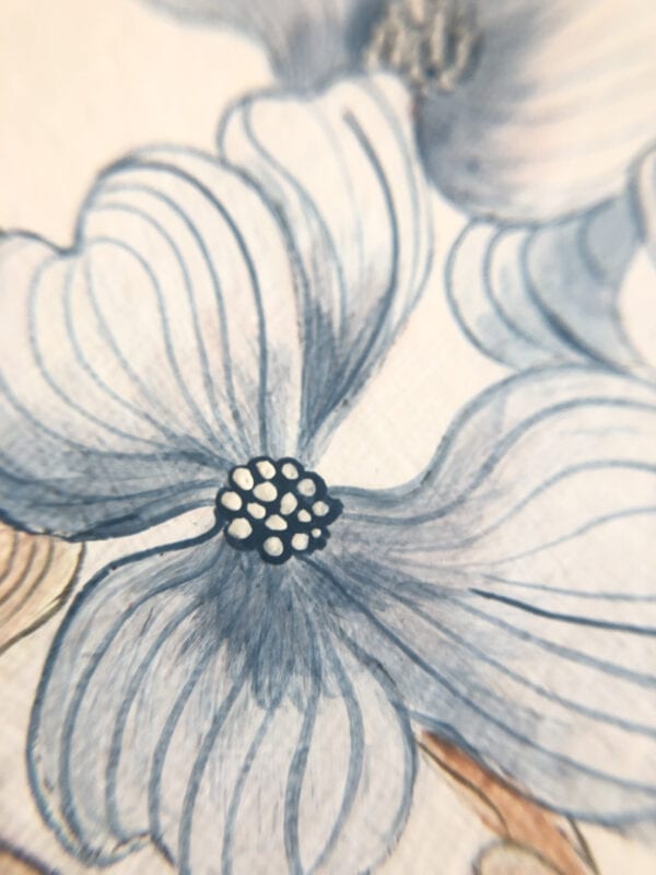 A close up of blue flowers on a piece of paper.
