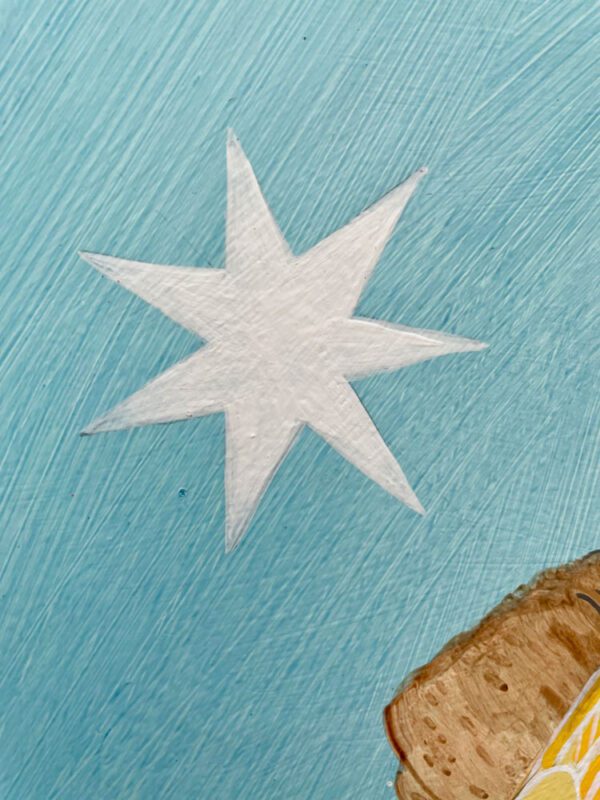 A painting of a star on a piece of bread.