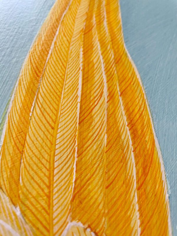 A painting of a yellow feather on a blue background.