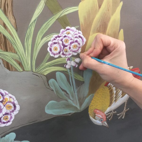 A person is creating a "Forest and Pheasants" Chinoiserie triptych art print of a bird and flowers.